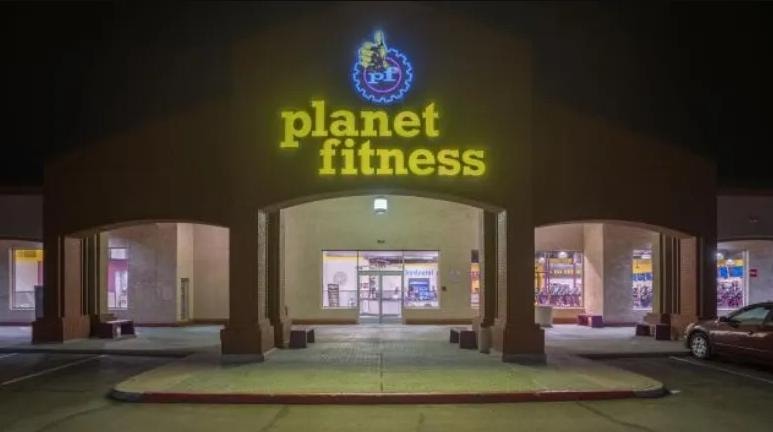 Fitness gym storefront at night